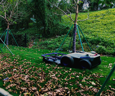 City-use mower performing grass cutting operations